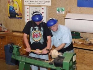 David helping a student with bowl gouge. At the demo each student is encouraged to have a hands on experience.
