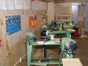 Some of the 7 lathes available for the students. The grinder and jigs were provided by the club.
