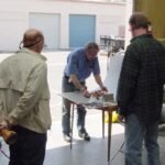 Using small blocks or clay to tip object up