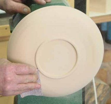 Final sanding of the bottom to 600 grit prior to spraying with lacquer. This seals the wood pores and prevents bleed through of the analine dye from