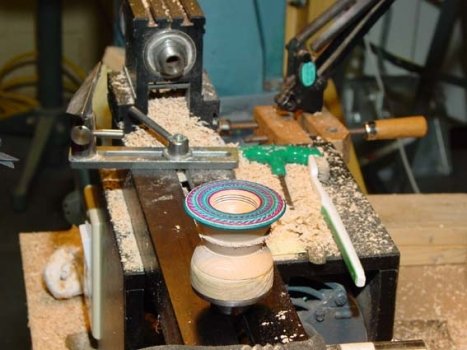 The spinning-top bottom has been threaded and decorated but is still left on the face plate