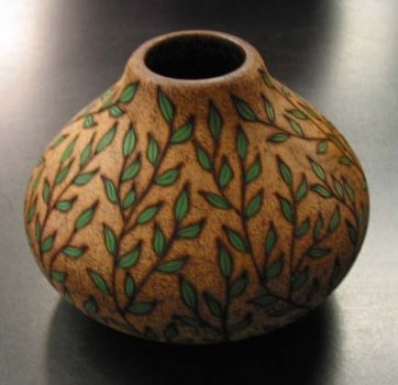 Example of hollow form decorated with pyrography, coloring and texturing